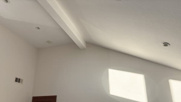 Interior wall finish with smooth texture and natural light highlighting clean workmanship