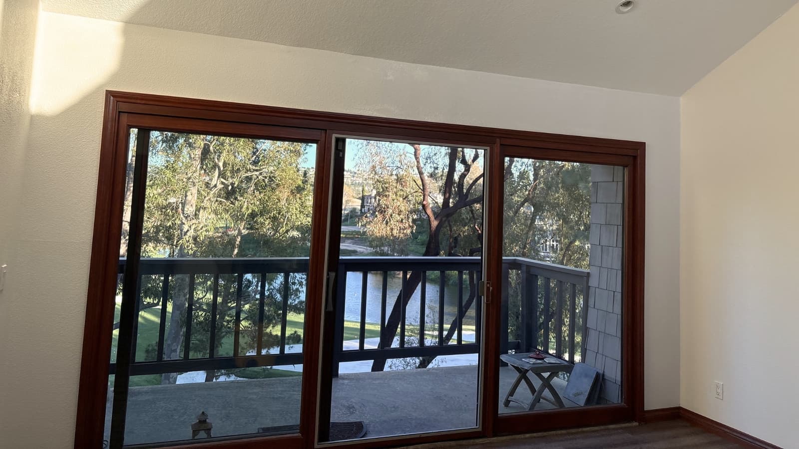 Interior finish with large sliding glass doors, wood trim, and bright natural lighting